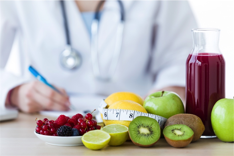 Naturopath with bowl of fruit