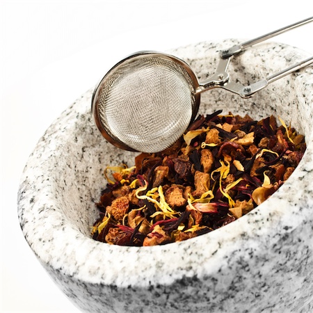 dried herbal medicine with mortar and pestle