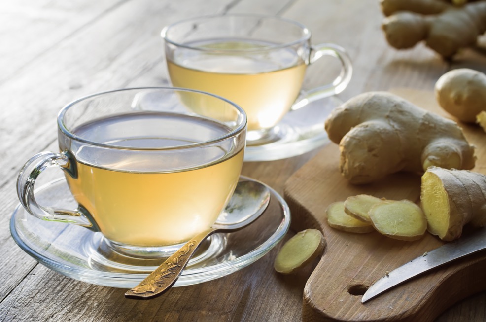 ginger tea with fresh ginger on a chopping board