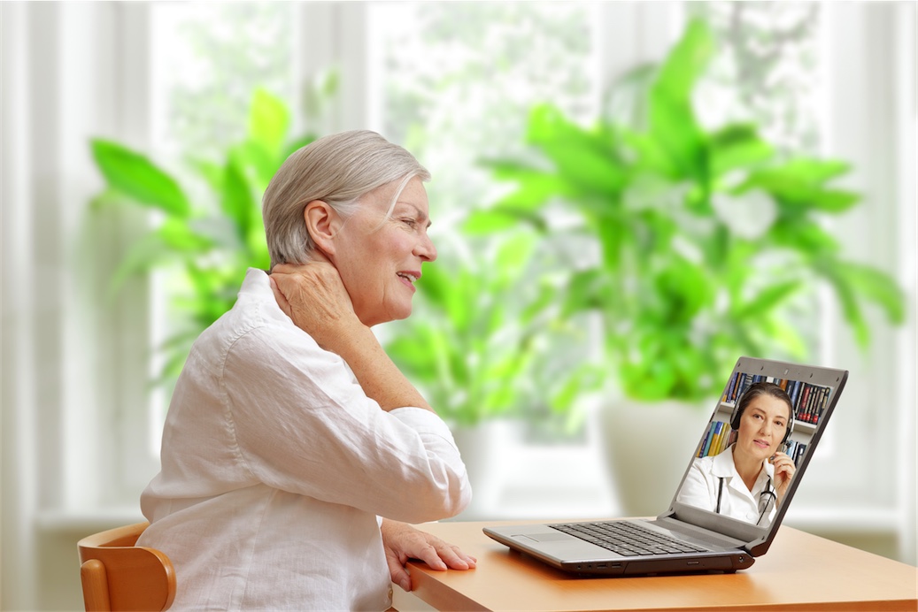 woman at desk using Naturopath telehealth