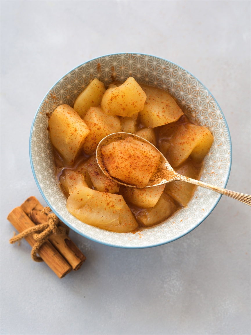 stewed apples in a bowl with cinnamon
