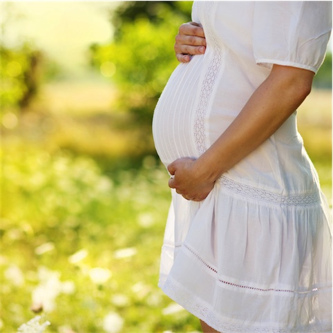 pregnant woman in white dress naturopathy fertility support
