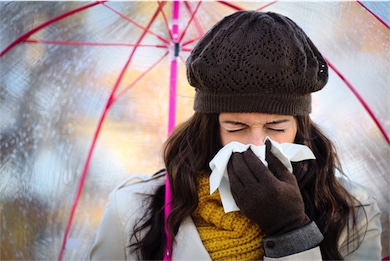 naturoapthy immune treatment woman under umbrella sneezing